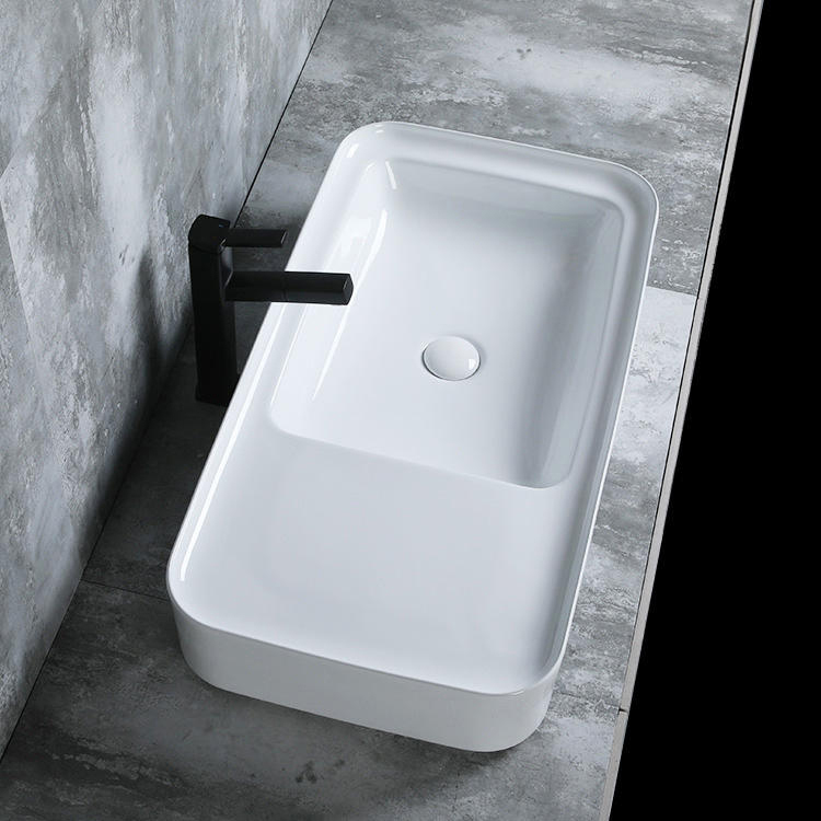 Le navire blanc de salle de bains de forme spéciale faite sur commande coule au-dessus du lavabo d'art en céramique de comptoir en porcelaine